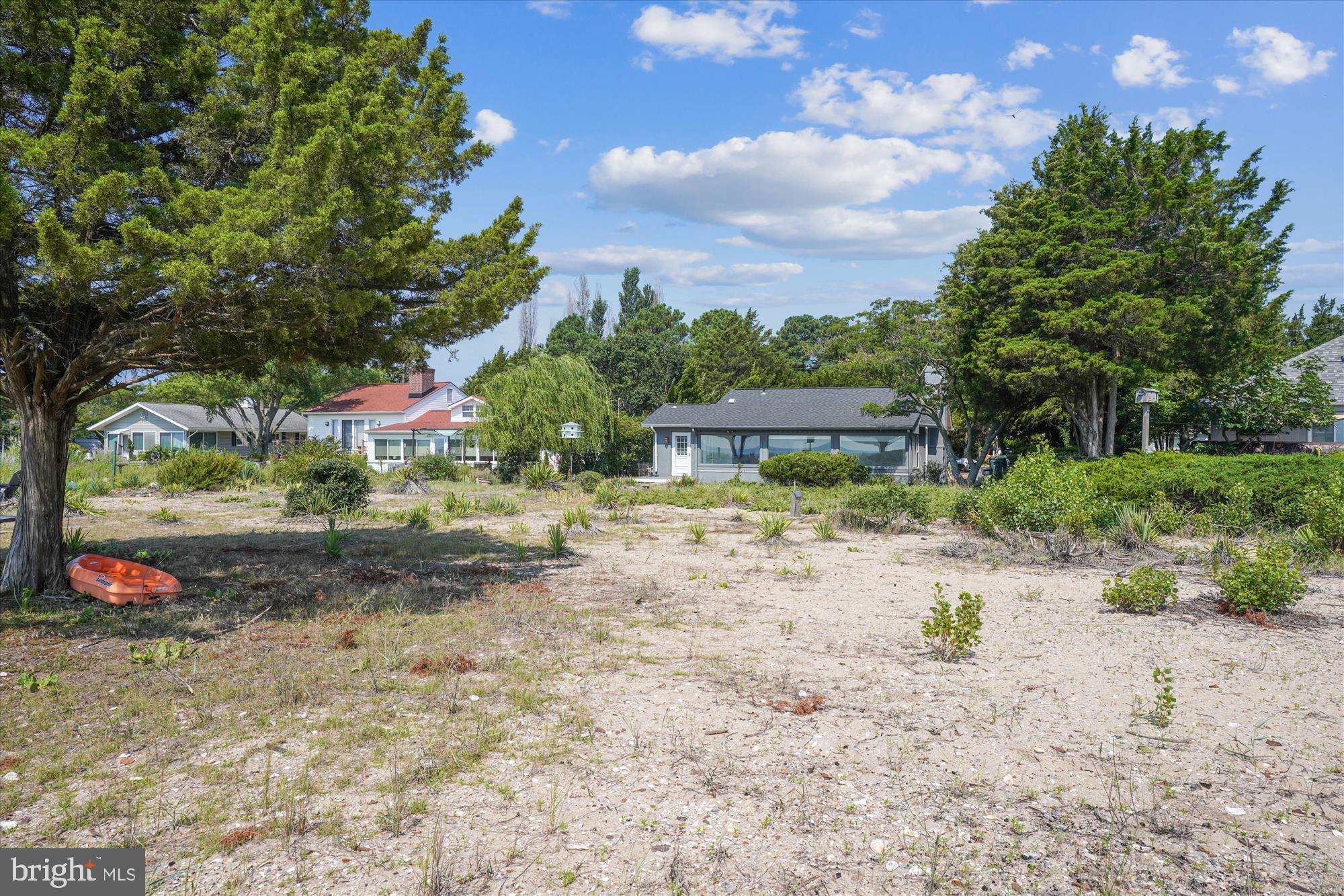 3143 Calvert Boulevard Lusby, MD 20657 - Photo 10 of 36 a backyard of a house with a yard and outdoor seating