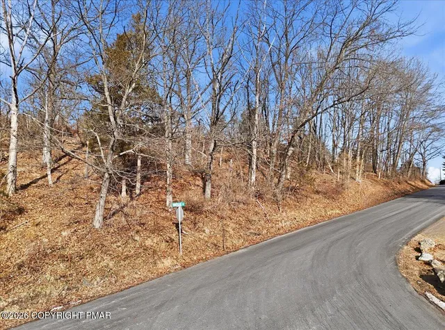 a view of swimming pool from a balcony
