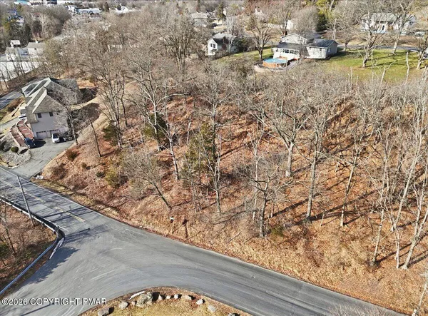 an aerial view of residential house and lake view