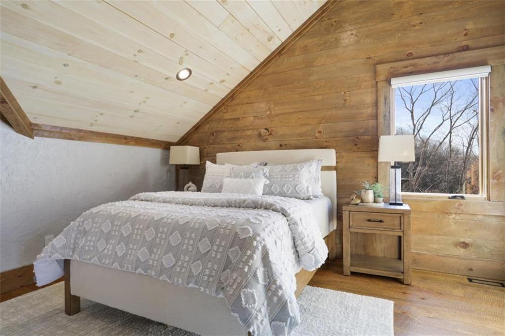 226 Round Top Road Mineral Bluff, GA 30559 - Photo 12 of 78 a bedroom with a bed and a window