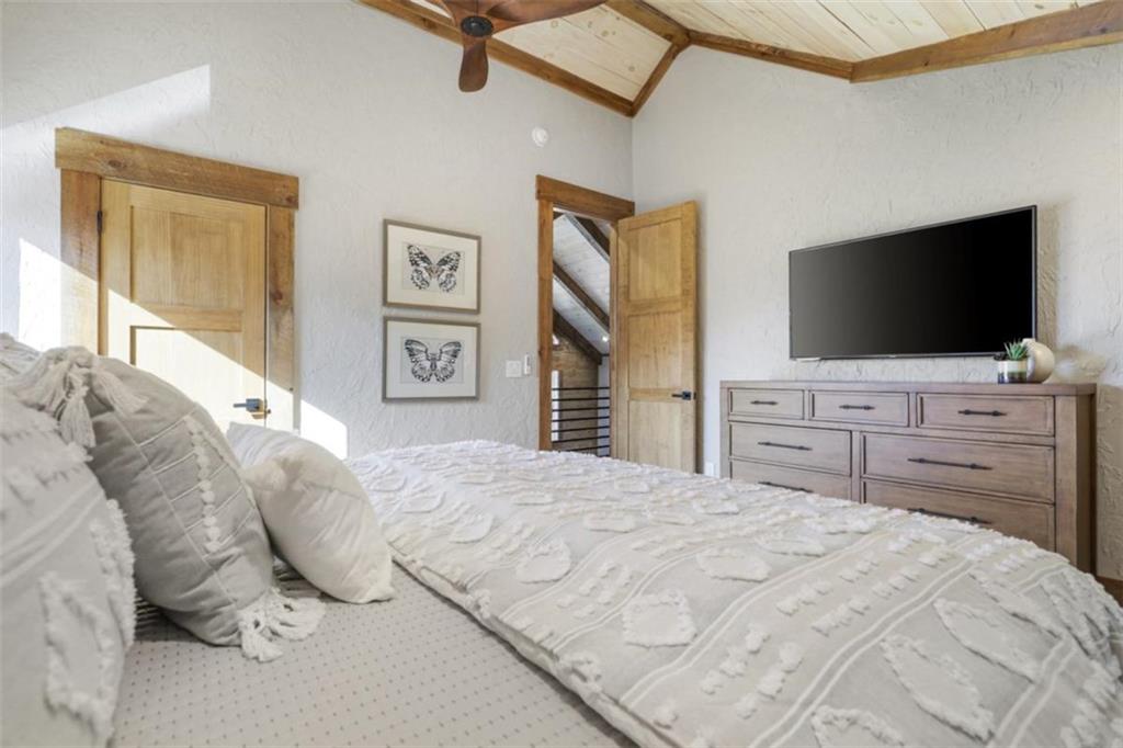 226 Round Top Road Mineral Bluff, GA 30559 - Photo 13 of 78 a bedroom with a bed and a flat screen tv