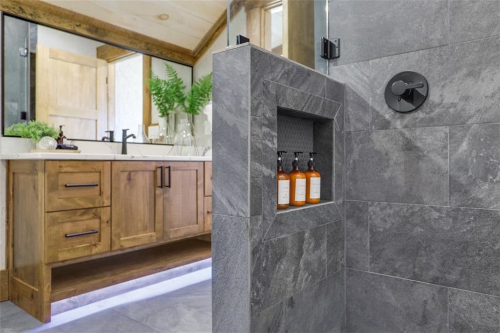 226 Round Top Road Mineral Bluff, GA 30559 - Photo 17 of 78 a bathroom with a sink a mirror and a window