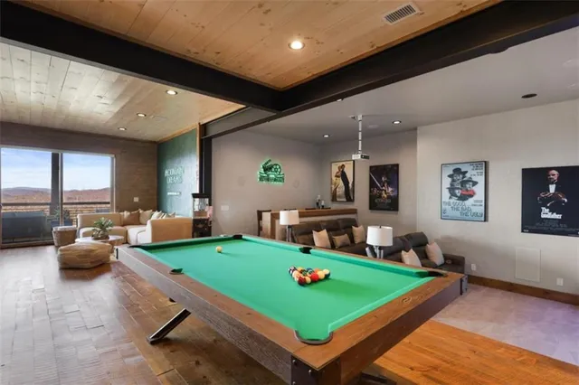 a view of a balcony with lake view and wooden floor