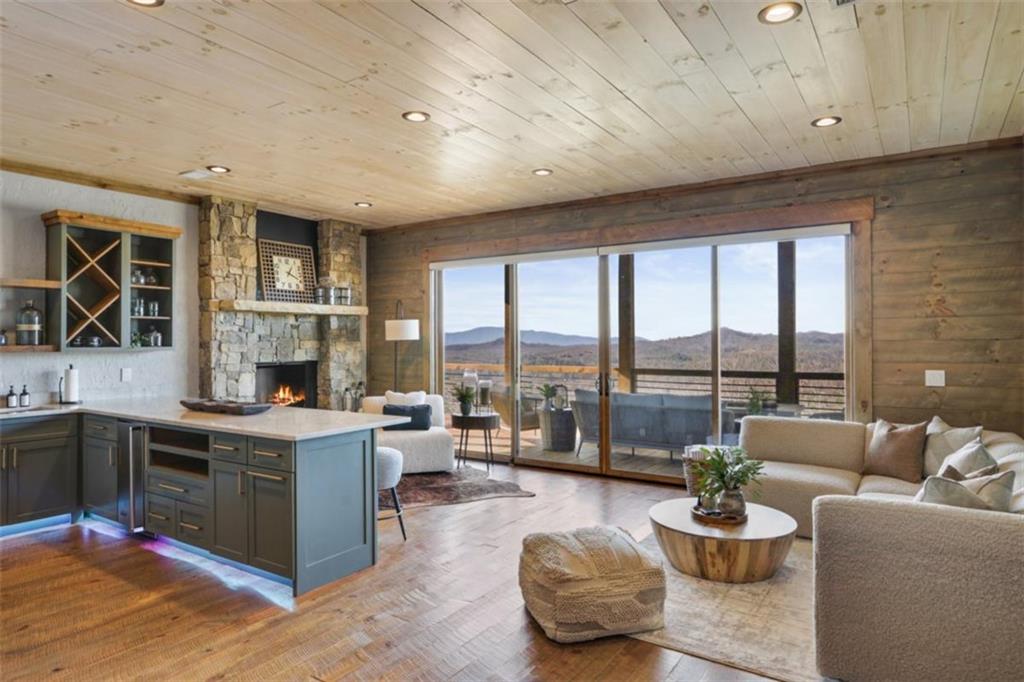 226 Round Top Road Mineral Bluff, GA 30559 - Photo 27 of 78 a living room with furniture and a fireplace
