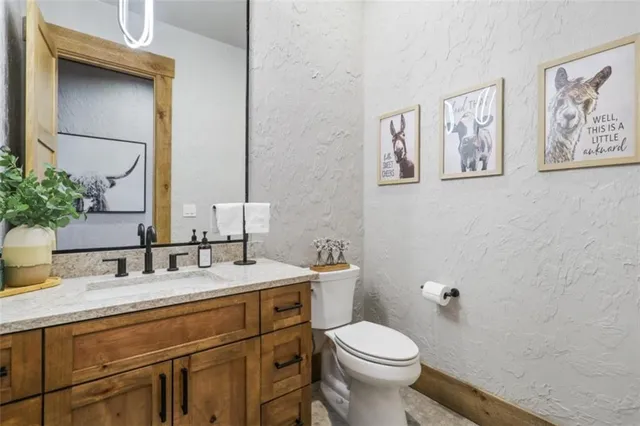 a living room with furniture fireplace and flat screen tv
