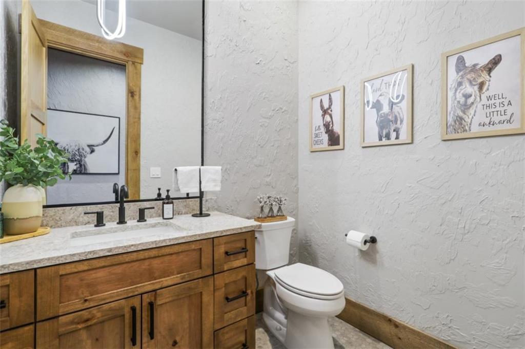 226 Round Top Road Mineral Bluff, GA 30559 - Photo 28 of 78 a bathroom with a toilet sink and mirror
