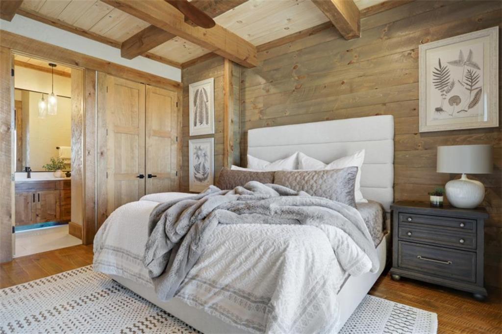 226 Round Top Road Mineral Bluff, GA 30559 - Photo 30 of 78 a bedroom with a bed and wooden floor