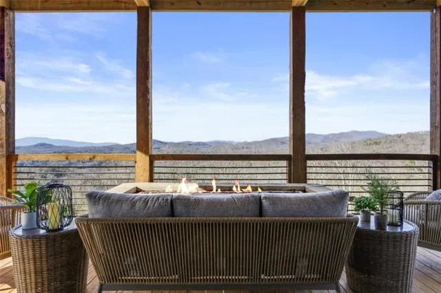 a living room with furniture fireplace and flat screen tv