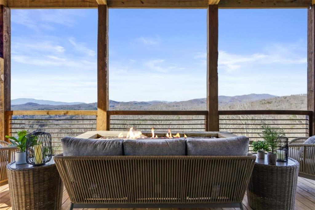 226 Round Top Road Mineral Bluff, GA 30559 - Photo 33 of 78 a view of a balcony with lake view and wooden floor