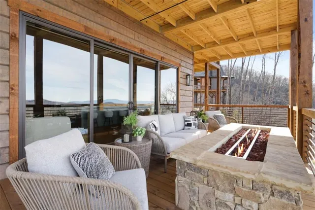 a living room with furniture fireplace and flat screen tv