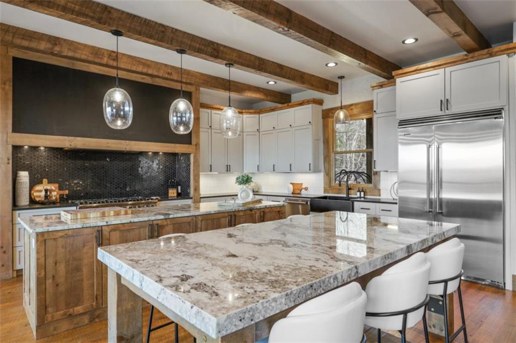 226 Round Top Road Mineral Bluff, GA 30559 - Photo 44 of 78 a kitchen with stainless steel appliances granite countertop a sink and a refrigerator