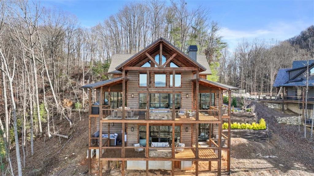 226 Round Top Road Mineral Bluff, GA 30559 - Photo 5 of 78 a front view of a house with swimming pool and sitting area