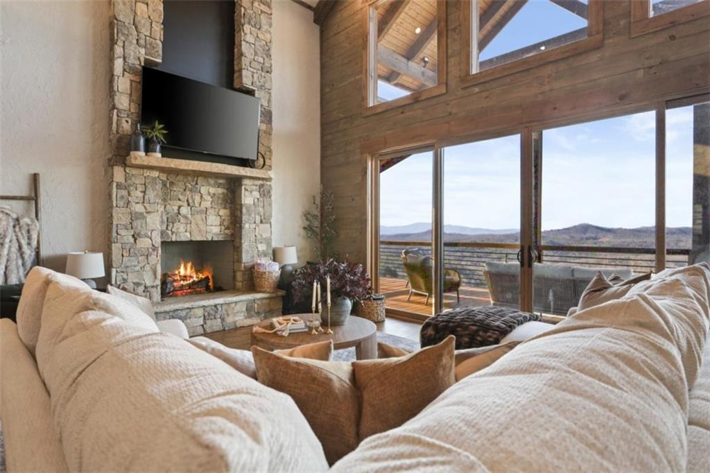 226 Round Top Road Mineral Bluff, GA 30559 - Photo 54 of 78 a living room with fireplace furniture and a flat screen tv