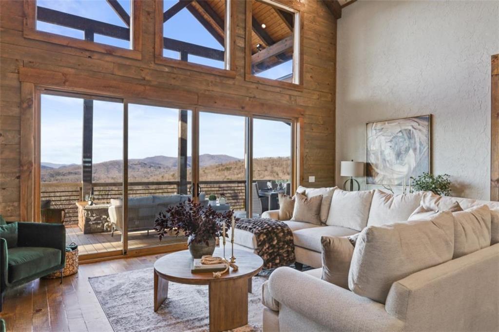 226 Round Top Road Mineral Bluff, GA 30559 - Photo 59 of 78 a living room with furniture and a large window