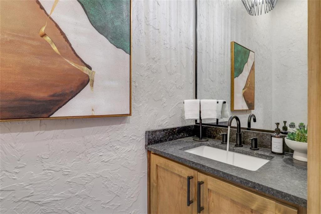 226 Round Top Road Mineral Bluff, GA 30559 - Photo 61 of 78 a bathroom with a granite countertop sink and a mirror