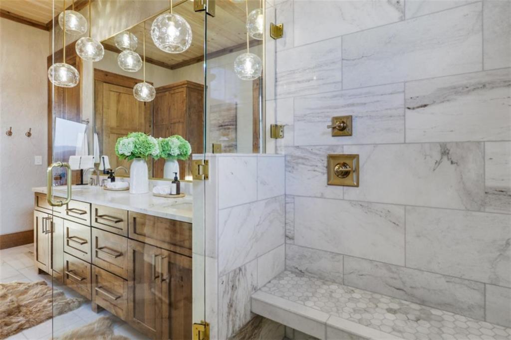 226 Round Top Road Mineral Bluff, GA 30559 - Photo 70 of 78 a bathroom with a sink mirror and a shower
