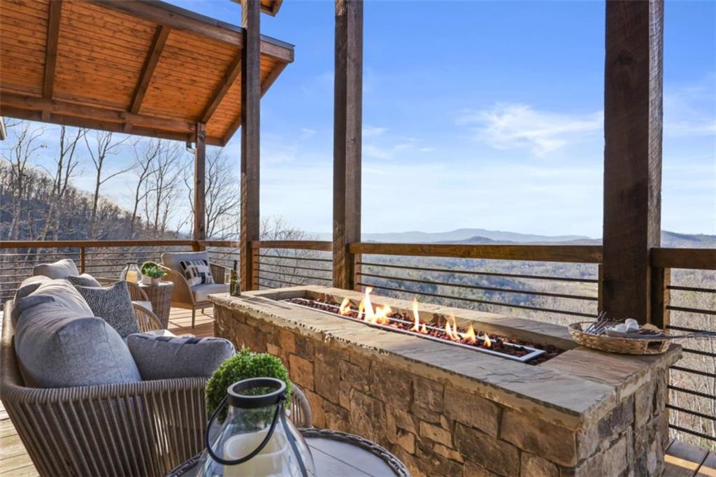 226 Round Top Road Mineral Bluff, GA 30559 - Photo 72 of 78 a balcony with furniture and outdoor view