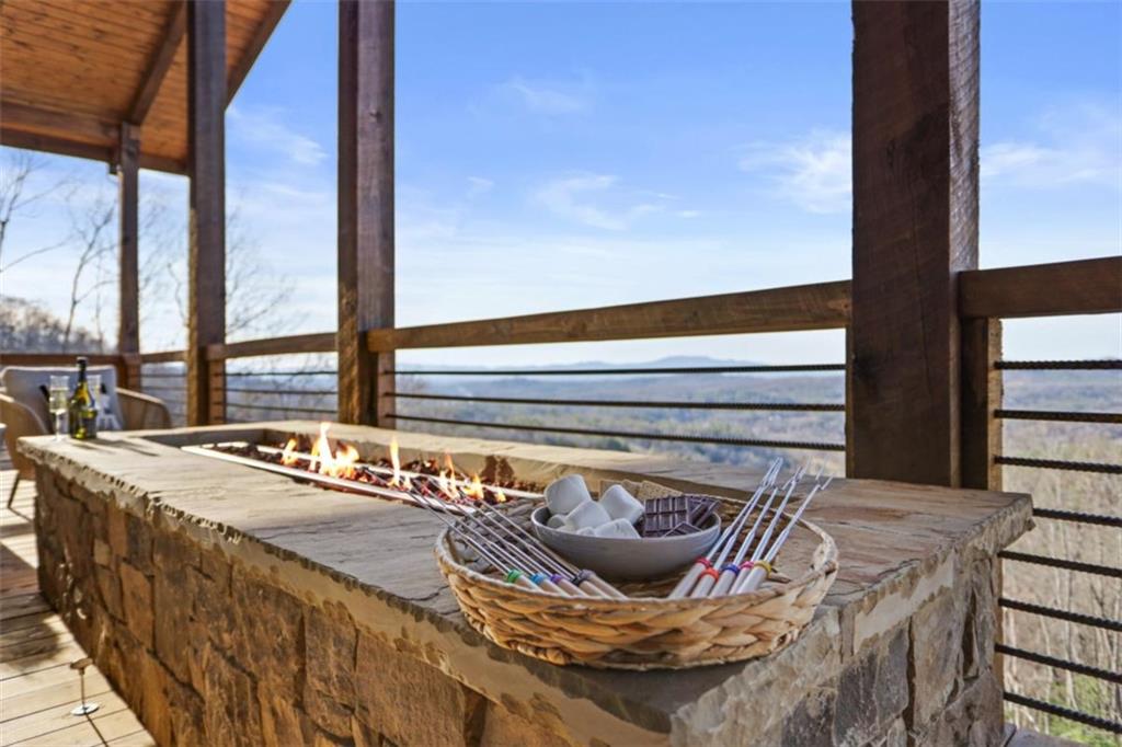 226 Round Top Road Mineral Bluff, GA 30559 - Photo 73 of 78 a living room with furniture and a floor to ceiling window