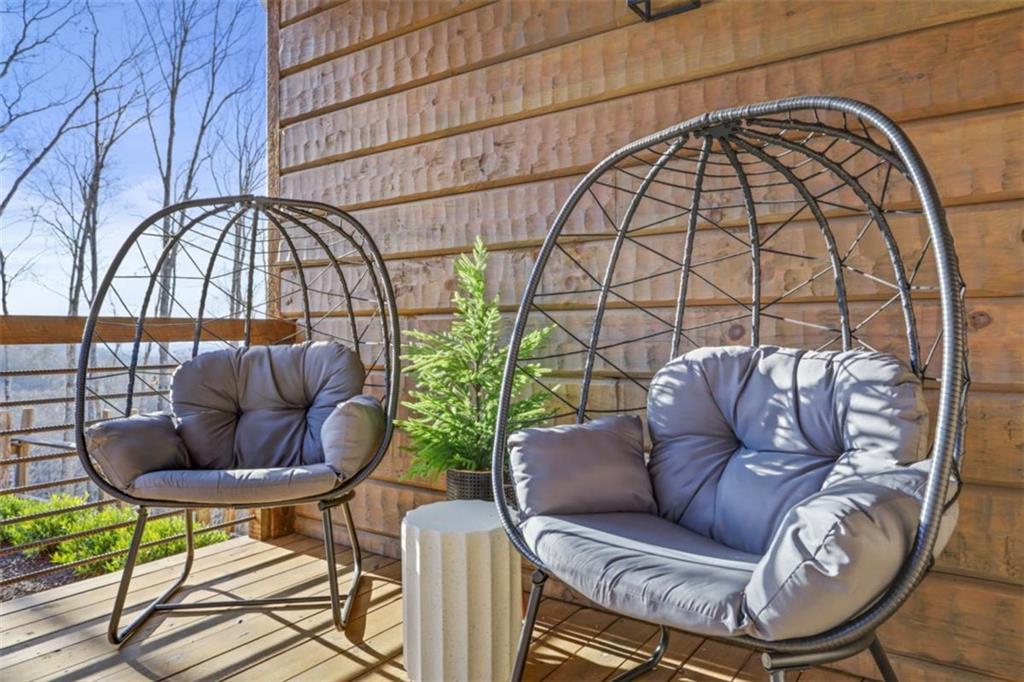 226 Round Top Road Mineral Bluff, GA 30559 - Photo 78 of 78 a living room with furniture and a floor to ceiling window