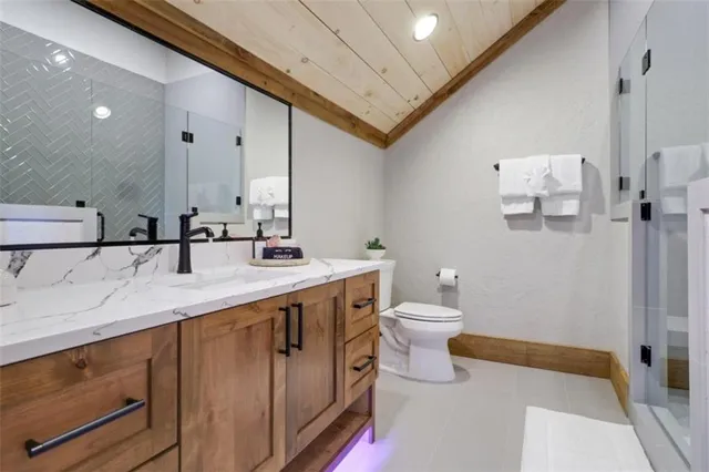 a bathroom with a sink a mirror and a window