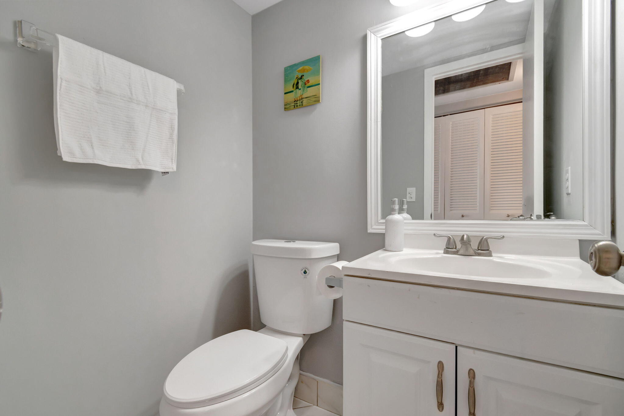 3031 Cornwall East Boca Raton, FL 33434 - Photo 13 of 84 a bathroom with a toilet sink and mirror