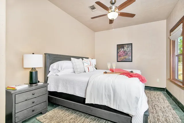 a bathroom with a toilet a sink and a mirror