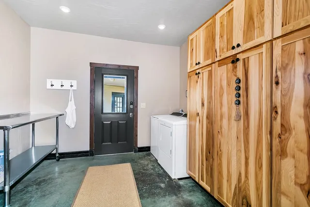 a view of a room with furniture and wooden floor