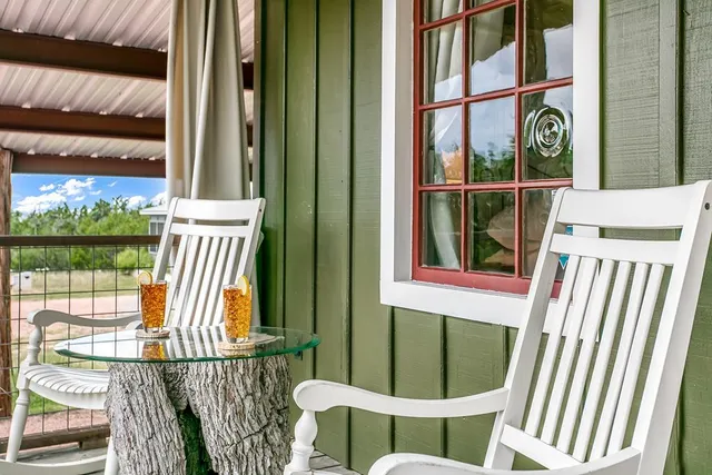a view of a balcony with furniture