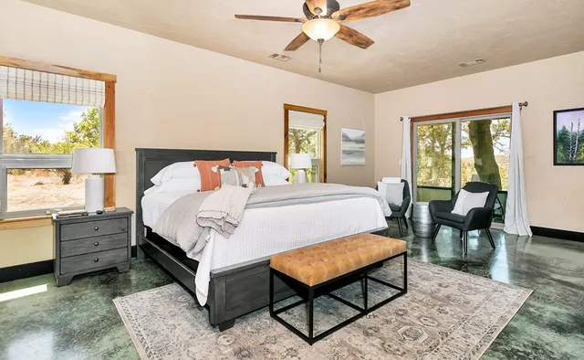 a bathroom with granite countertop a sink and a mirror