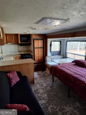 a bath room with a bed furniture and a window