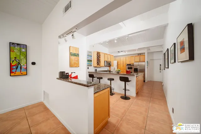 a view of storage and utility room with two washing machine