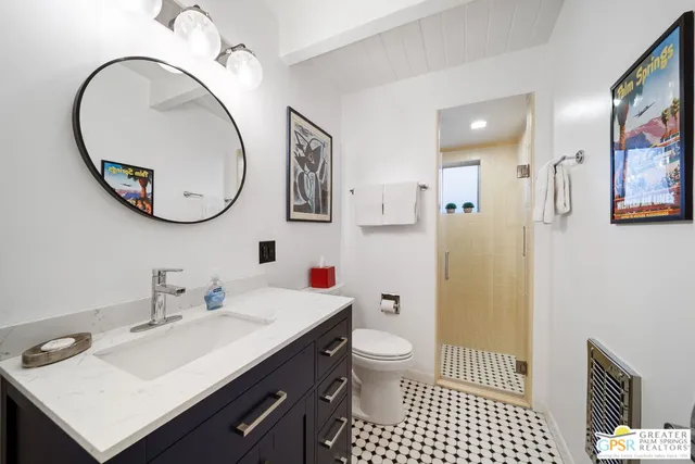 a view of a balcony with chairs and potted plants