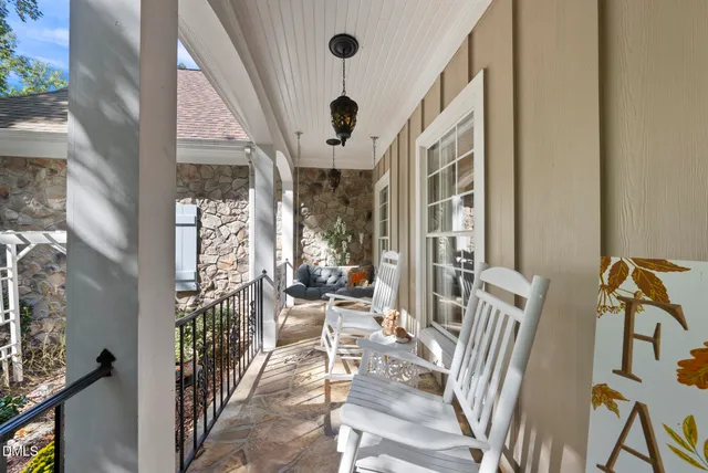 a view of an entryway with wooden floor and windows