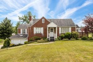 18 Ellen Drive McKees Rocks, PA 15136 - Photo 1 of 23 a front view of a house with garden