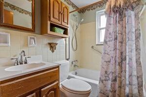 18 Ellen Drive McKees Rocks, PA 15136 - Photo 13 of 23 a bathroom with a sink a toilet and shower