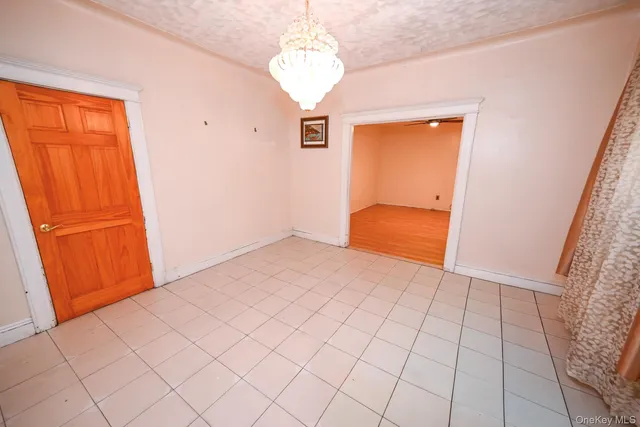 a view of a room with a wooden floor