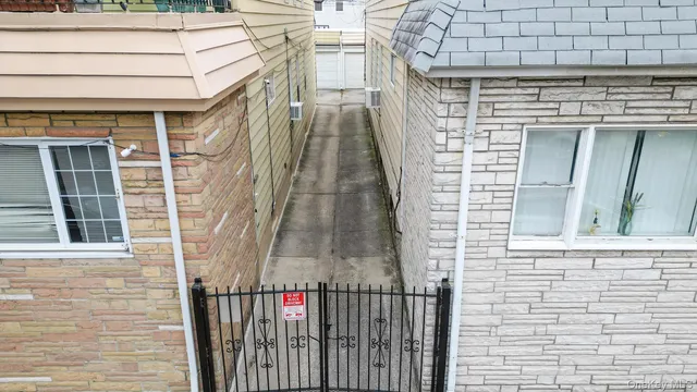 a view of a brick house with a large windows