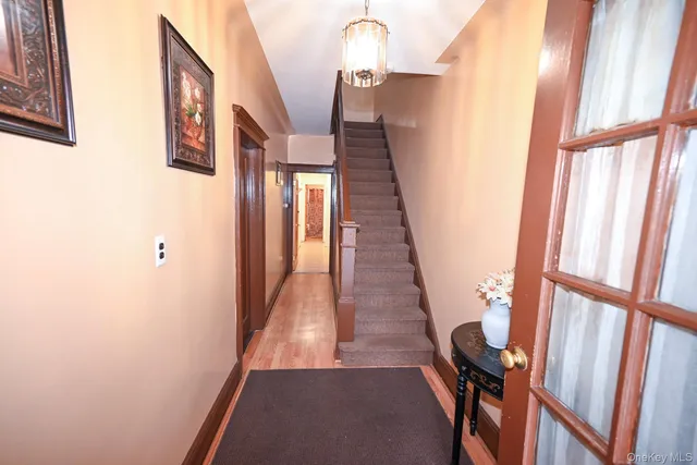 a view of an entryway with a mirror