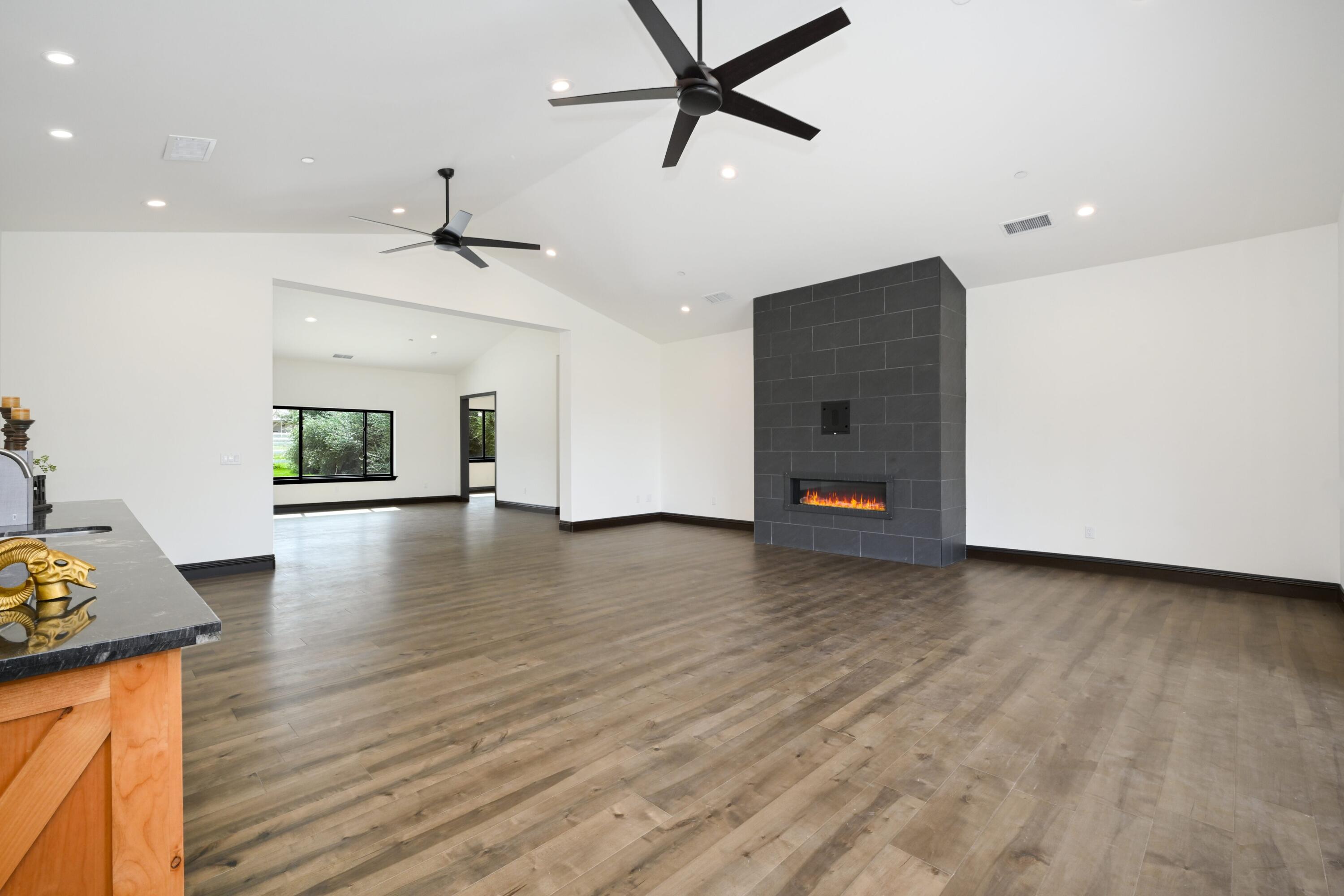17370 Rodeo Road Lake Elsinore, CA 92530 - Photo 14 of 68 a view of livingroom with hardwood floor and window