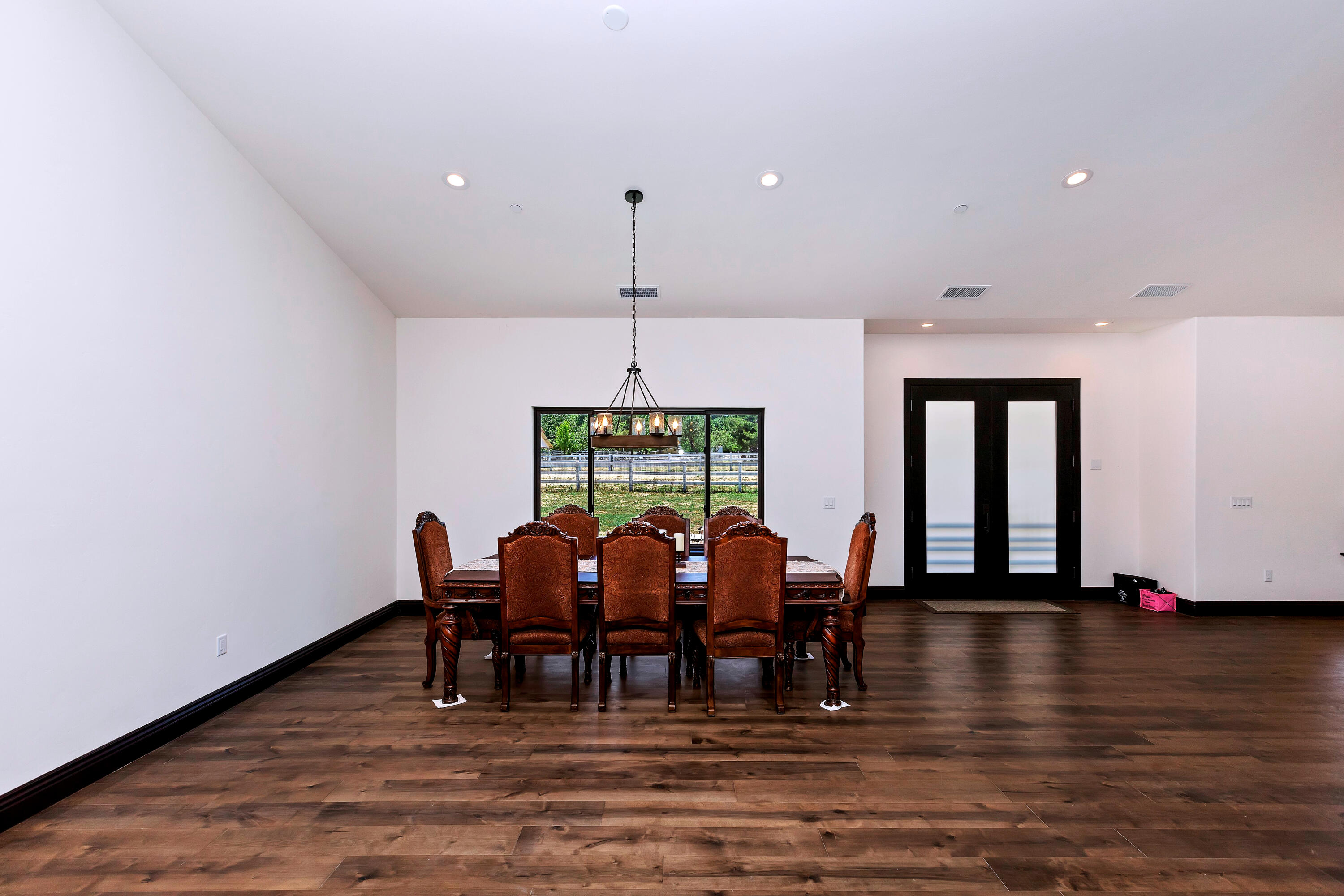 17370 Rodeo Road Lake Elsinore, CA 92530 - Photo 23 of 68 a view of a dining room with furniture window and wooden floor