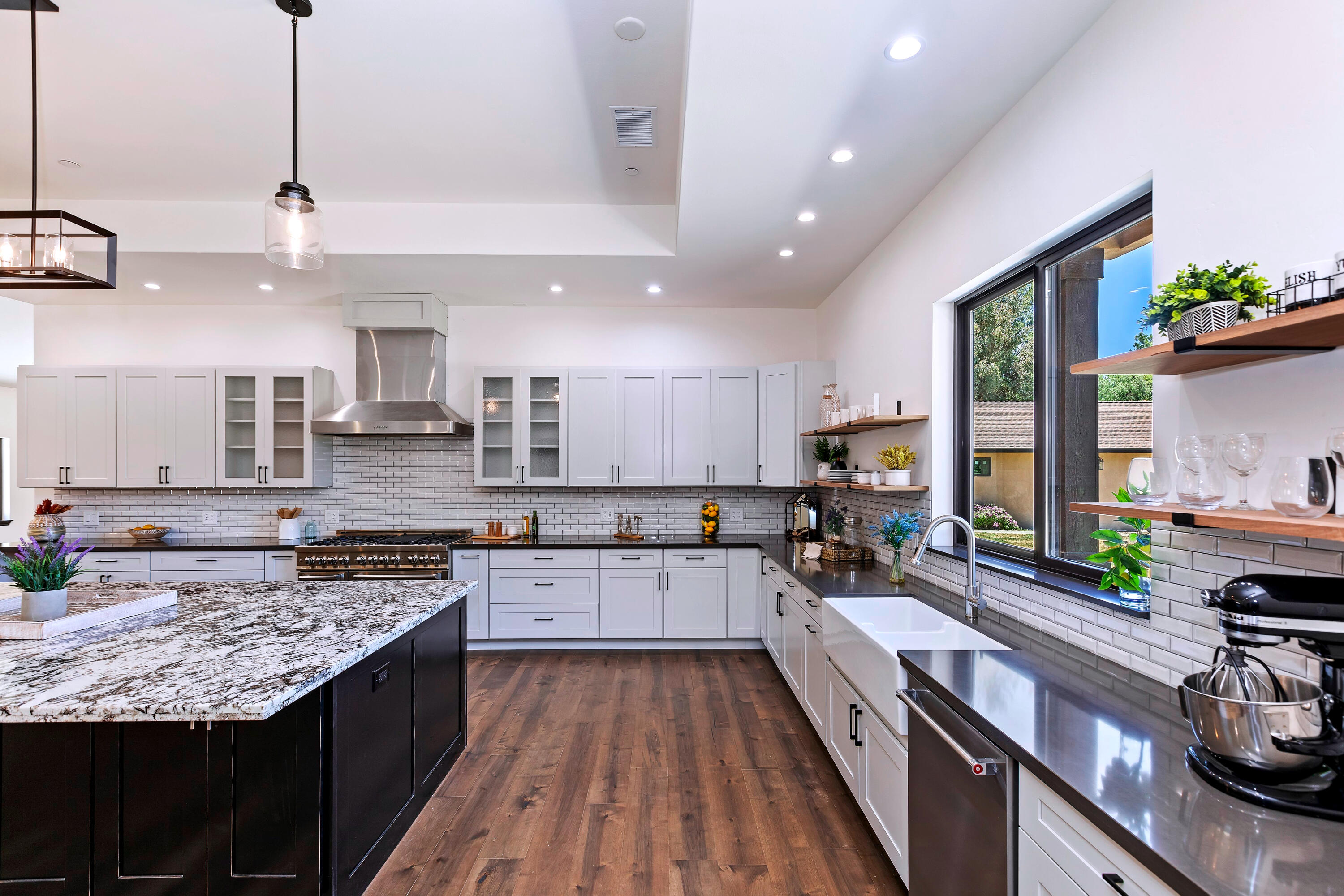 17370 Rodeo Road Lake Elsinore, CA 92530 - Photo 29 of 68 a large kitchen with granite countertop lots of counter space and stainless steel appliances