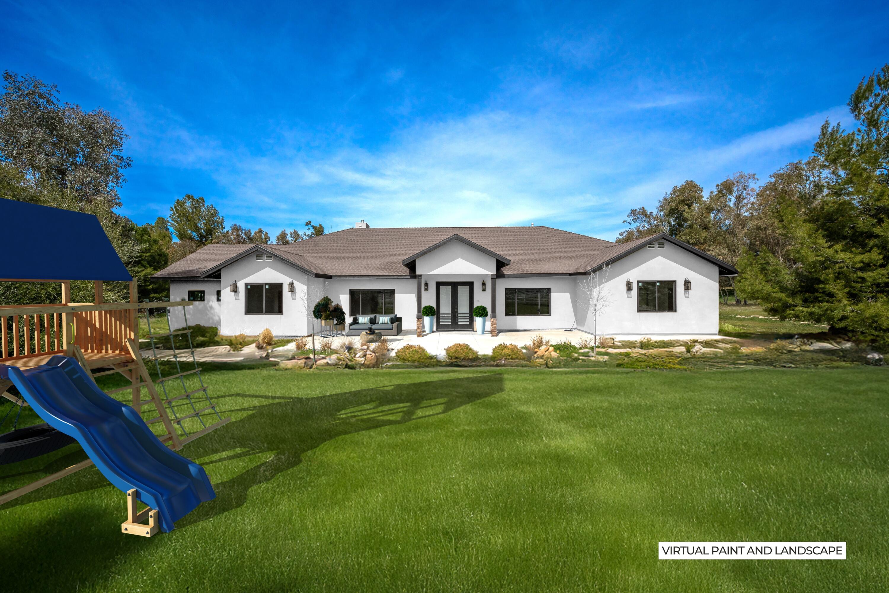 17370 Rodeo Road Lake Elsinore, CA 92530 - Photo 3 of 68 a front view of a house with a garden