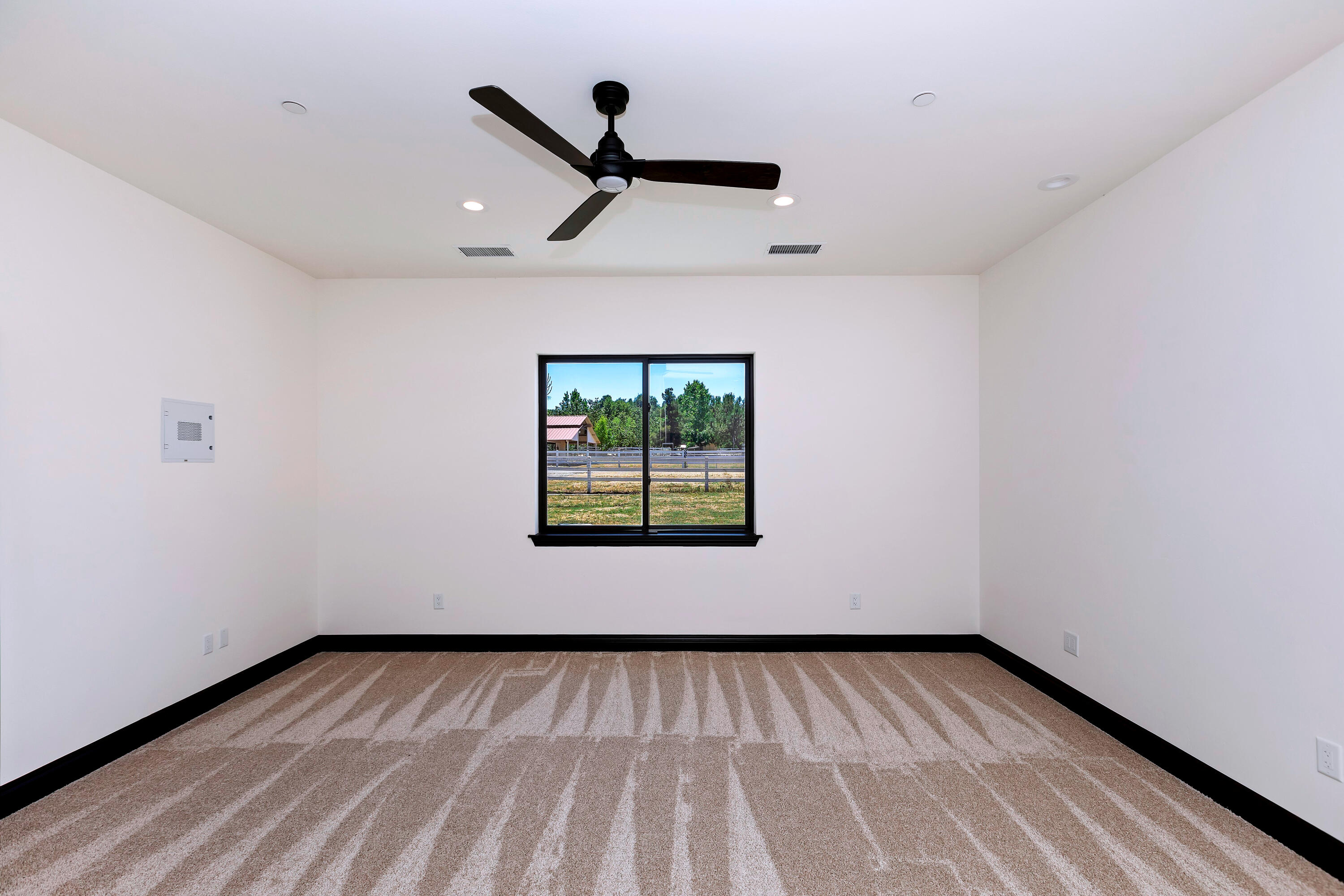 17370 Rodeo Road Lake Elsinore, CA 92530 - Photo 38 of 68 a view of an empty room with a window