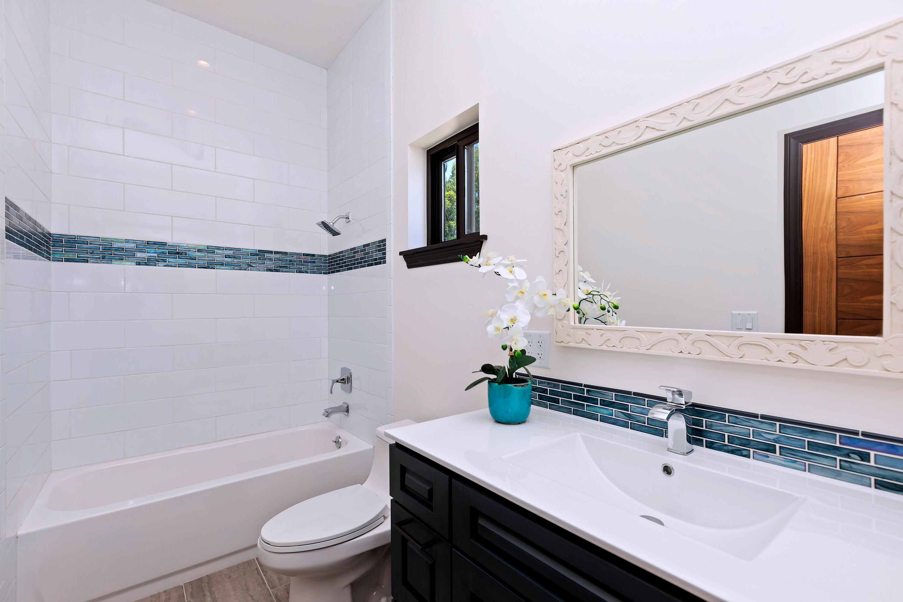 17370 Rodeo Road Lake Elsinore, CA 92530 - Photo 44 of 68 a bathroom with a sink and a mirror