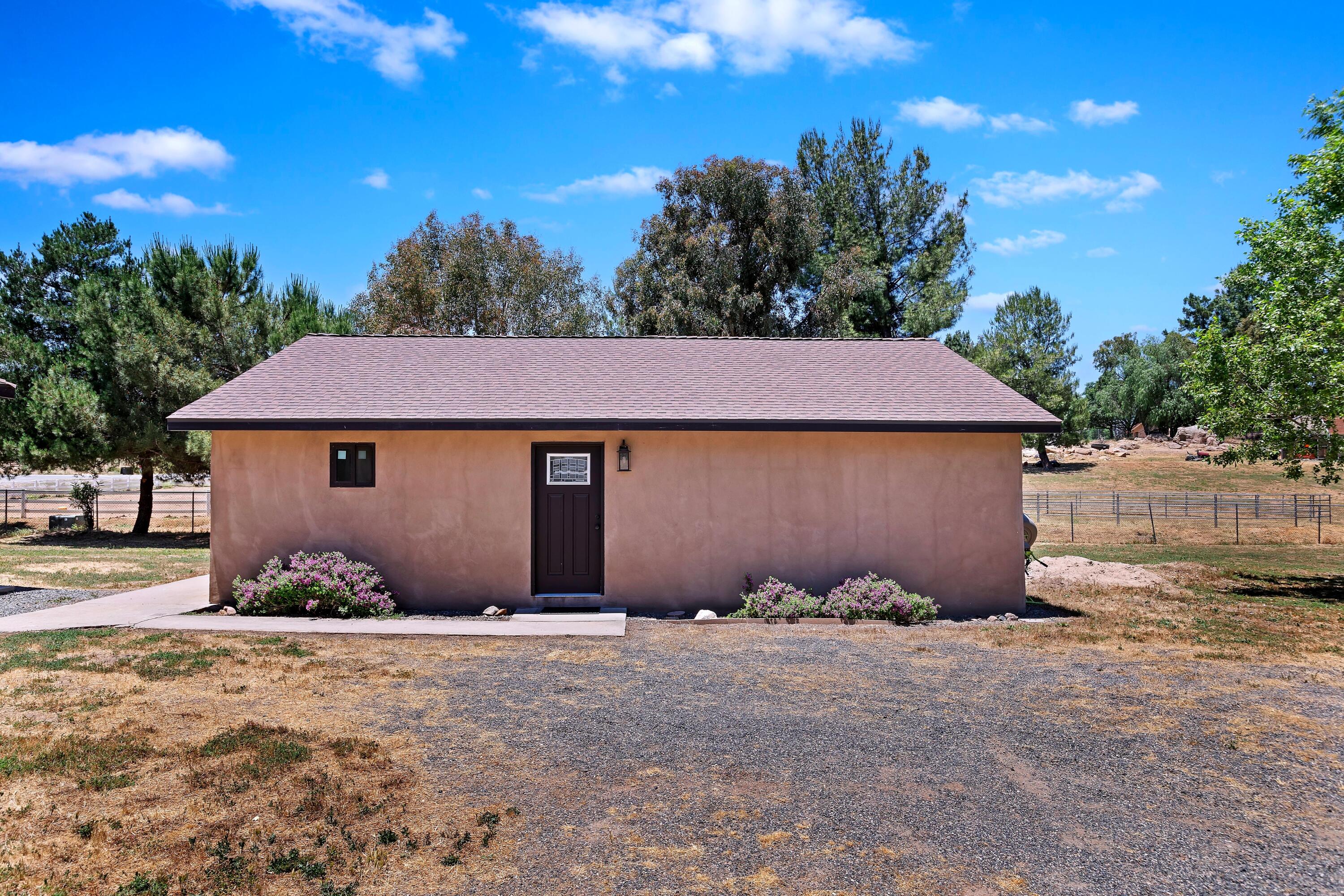 17370 Rodeo Road Lake Elsinore, CA 92530 - Photo 56 of 68 a front view of a house with a yard
