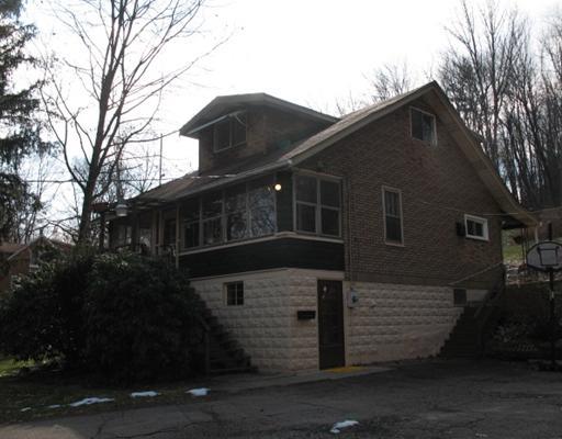327 Wible Run Road Pittsburgh, PA 15209 - Photo 2 of 18 Exterior Front. Walk out Basement has partial finiahed 12x14 room, unfinished laundry and utilitiy room and Storage room. Repairs required to redirect run off from hill.