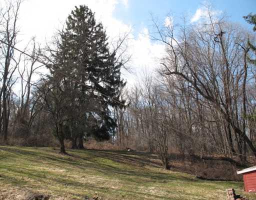 327 Wible Run Road Pittsburgh, PA 15209 - Photo 18 of 18 Yard/Garden. Wooded and open back yard slopes gradually toward the house and offers numerous opportunities for use as well as privacy and a nice view. Use your imagination. Lot has neighbors on both sides.