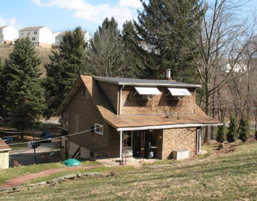 327 Wible Run Road Pittsburgh, PA 15209 - Photo 4 of 18 Exterior Back. Full dormer creates a large Master Bedroom overlooking the private backyard,