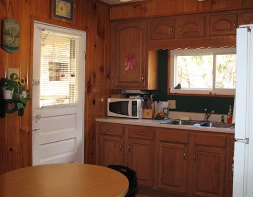 327 Wible Run Road Pittsburgh, PA 15209 - Photo 5 of 18 Kitchen. A warm & natural feel to this kitchen with knotty pine walls. Eat any meal at built in retro booth. Room for more cabinets and a dishwasher. Bring in even moe light with an updateddoor. A great start to a fantastic kitchen with little effort.