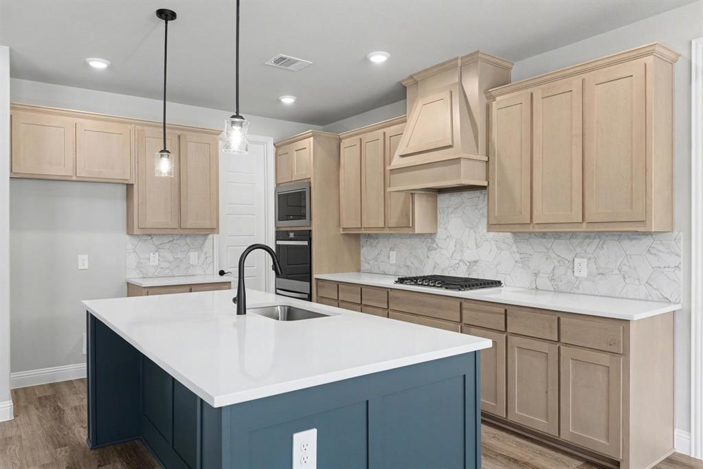 7041 Champion Road Midlothian, TX 76065 - Photo 11 of 30 a kitchen with stainless steel appliances granite countertop a sink a stove and a refrigerator